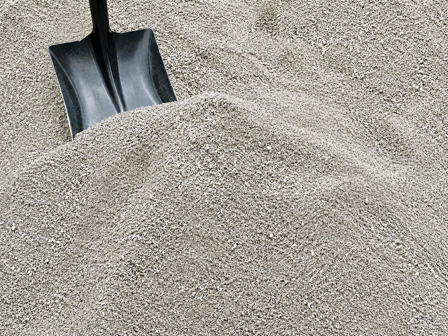 Paver fines material with shovel