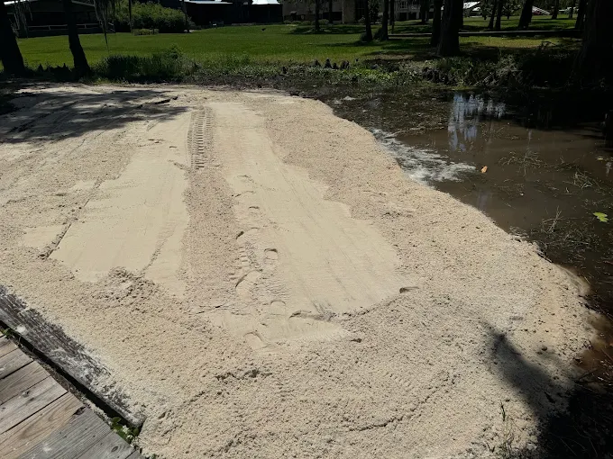 Fresh sand placed along a waterfront